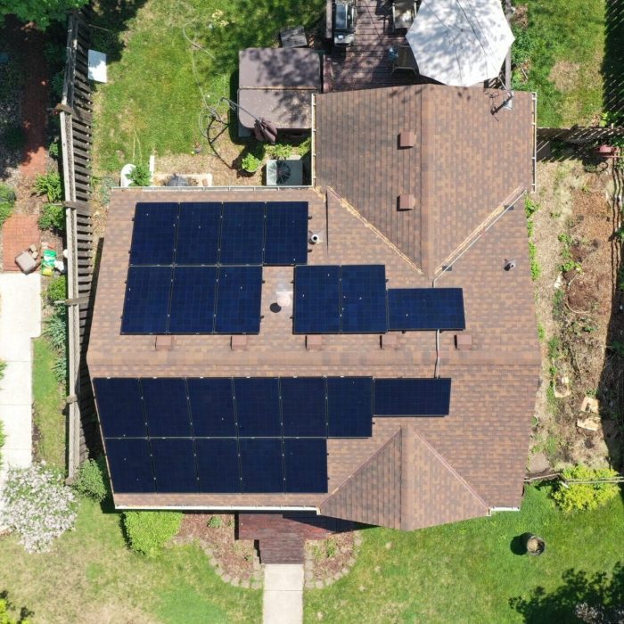 Residential solar panels on a roof under blue skies - Residential Solar Power