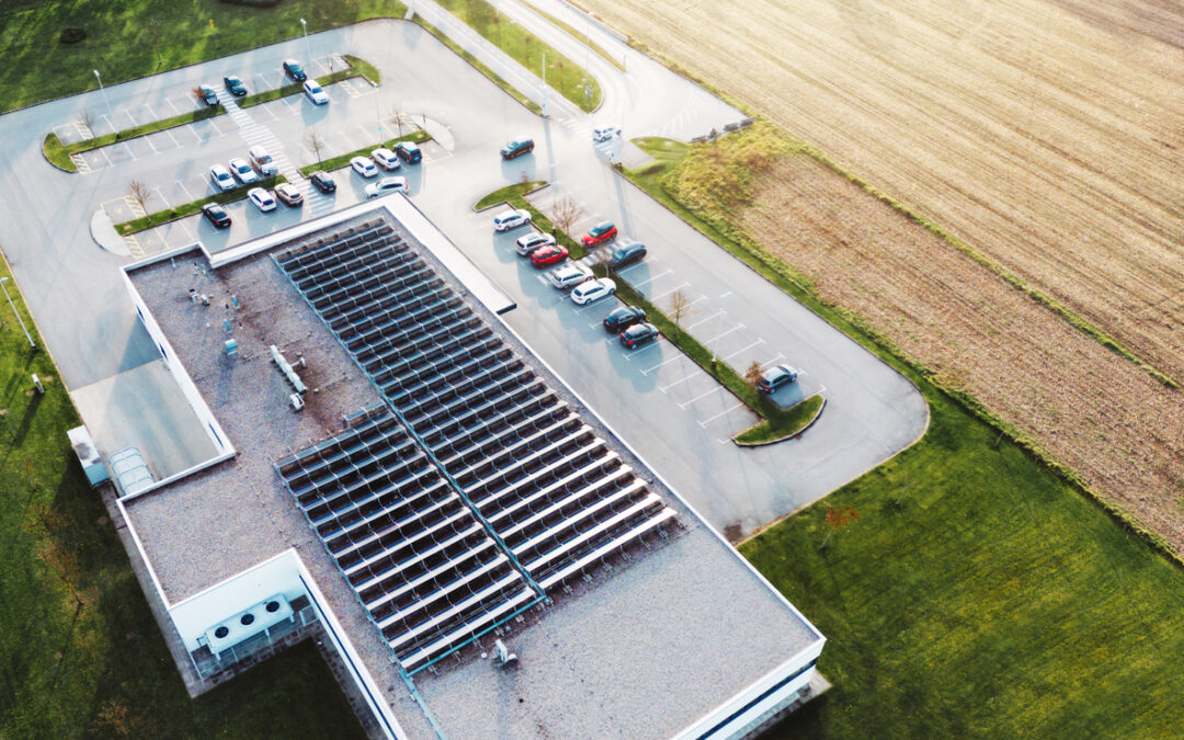 Solar panels against a clear blue sky, representing clean energy solutions. - Minnesota Solar Energy Company