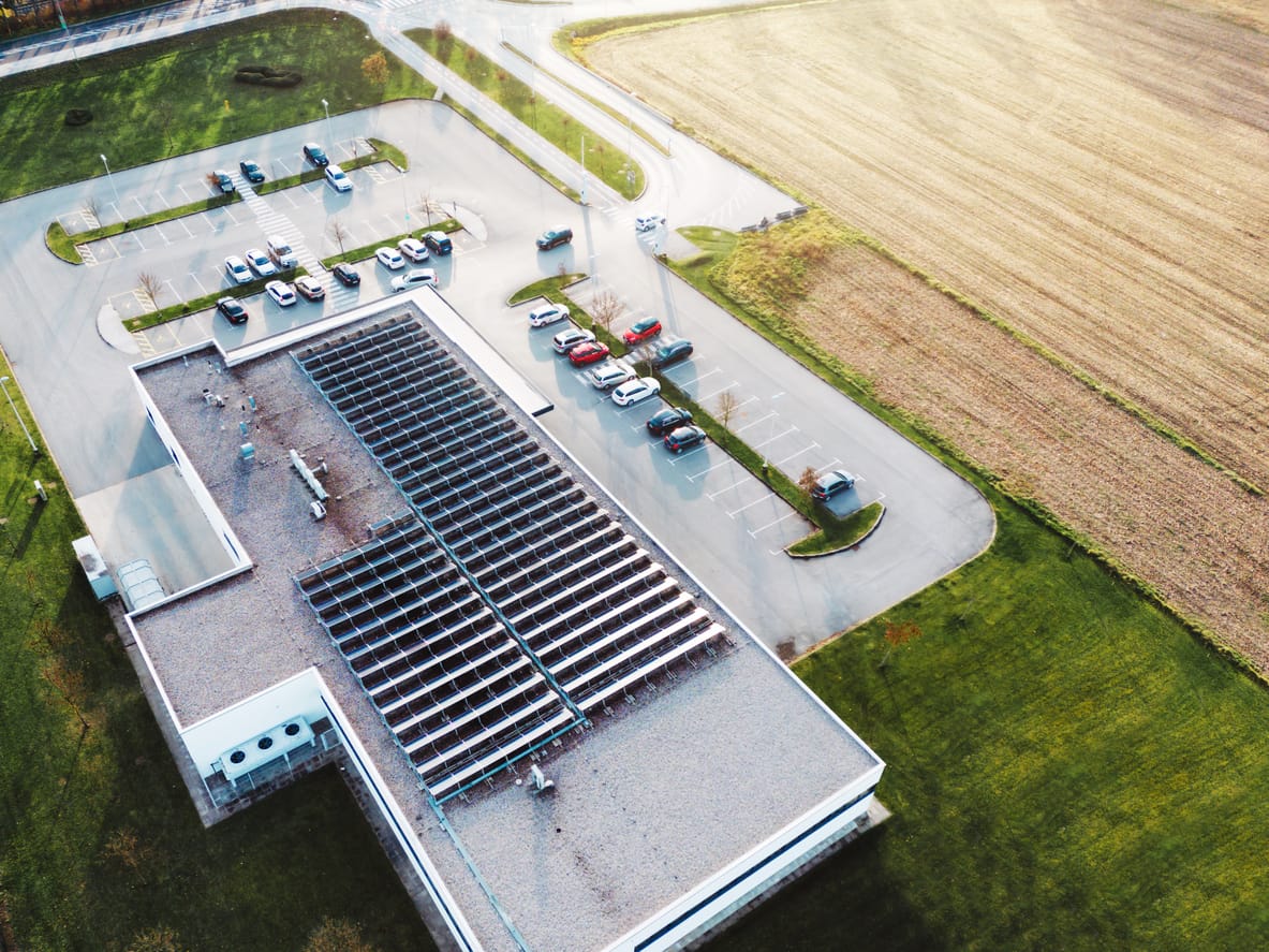 Solar panels against a clear blue sky, representing clean energy solutions. - Minnesota Solar Energy Company