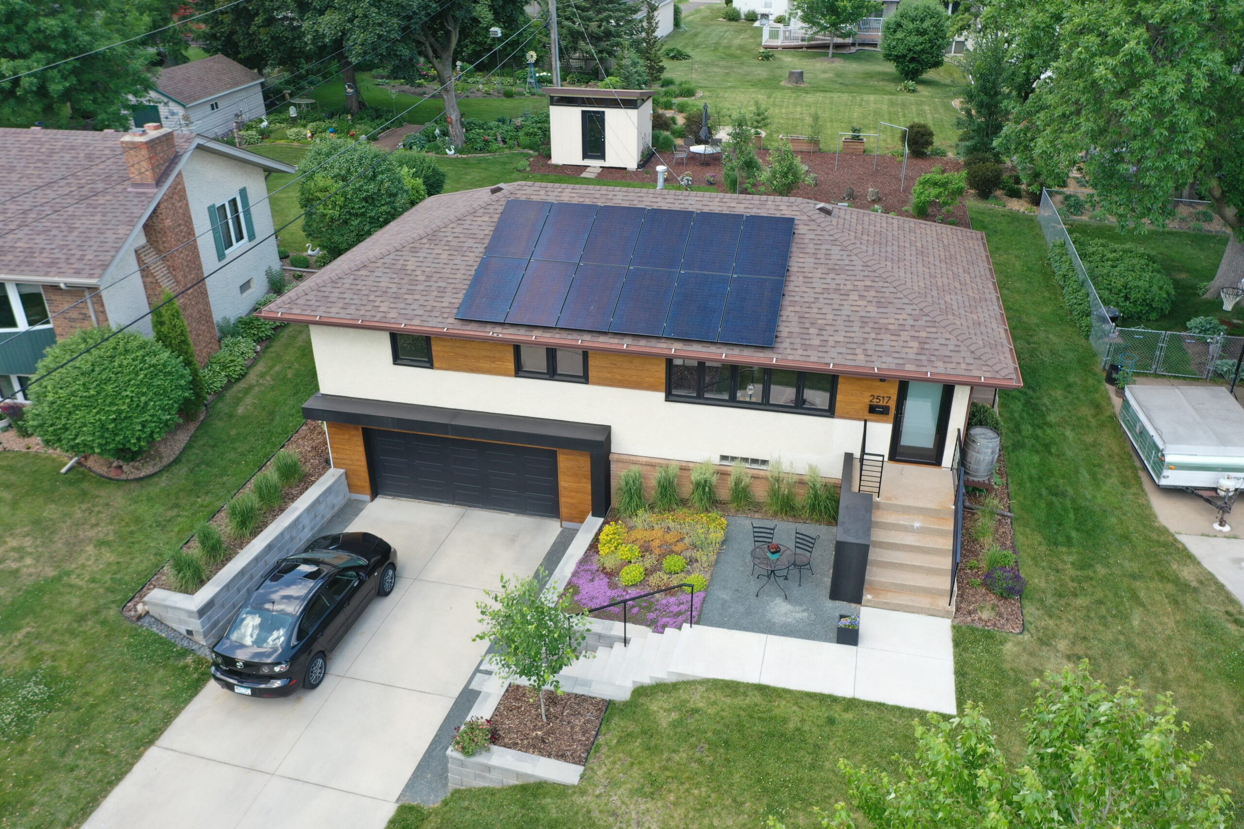 an aerial view of a house with a solar panel on the roof - Solar Sales Tax