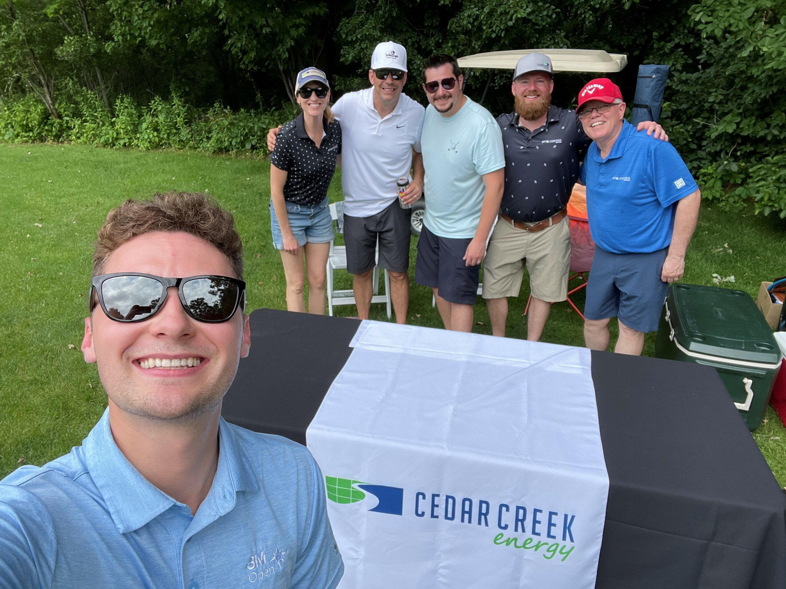 a group of Qualified Team Members around a table - Cedar Creek Energy