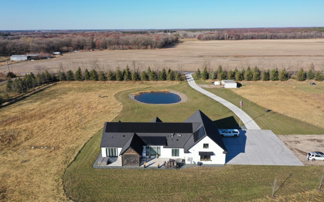 an aerial view of a house in the middle of a field - Solar Energy Increase Home