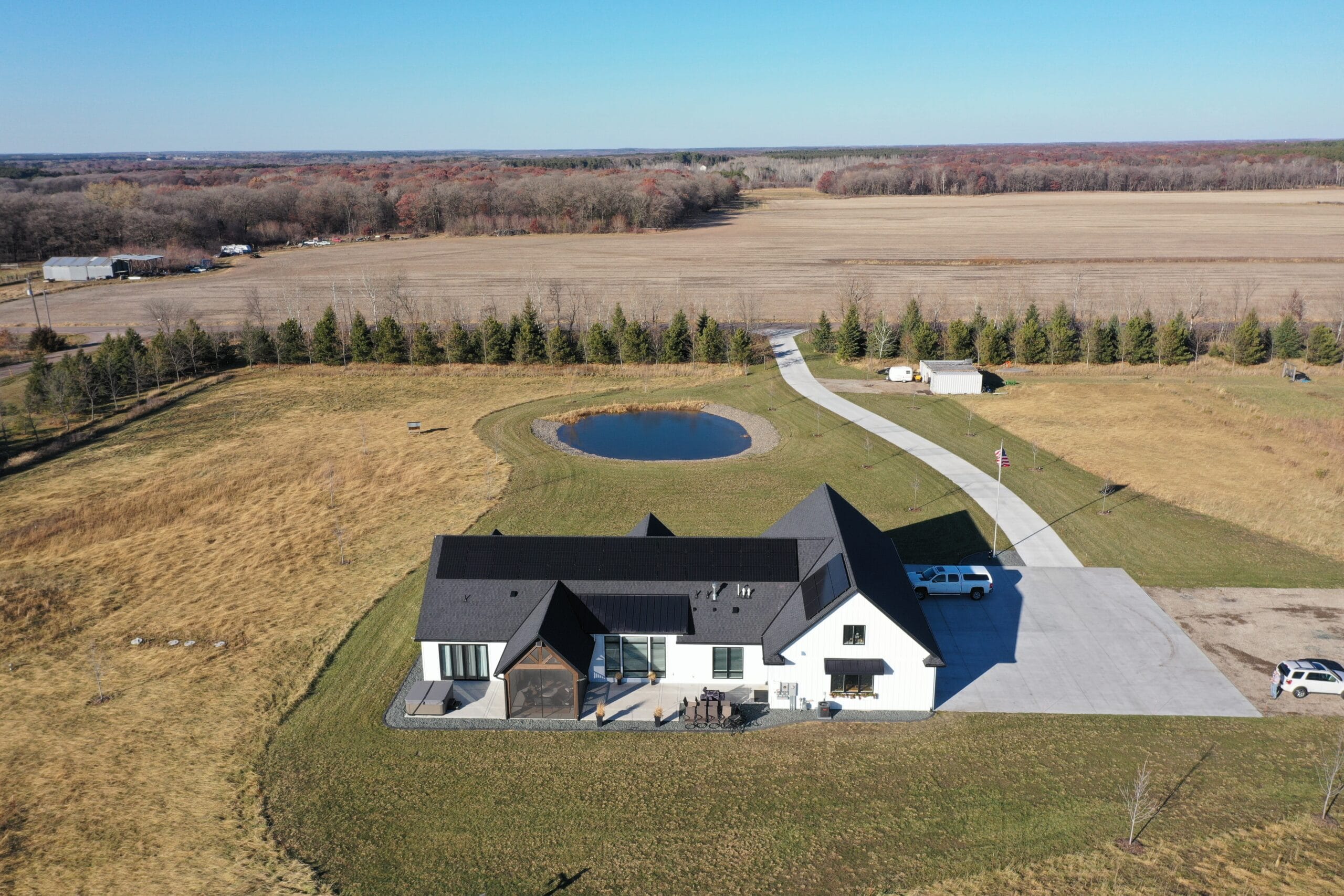 an aerial view of a house in the middle of a field - Solar Energy Increase Home